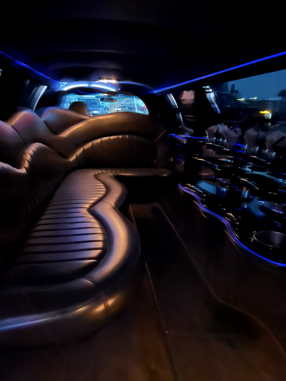 Classic interior of 10-passenger stretch limousine with leather seating and LED lighting