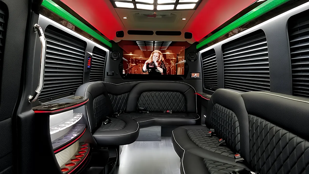 Interior of Mercedes Limo Sprinter with J-style lounge seating for concert night