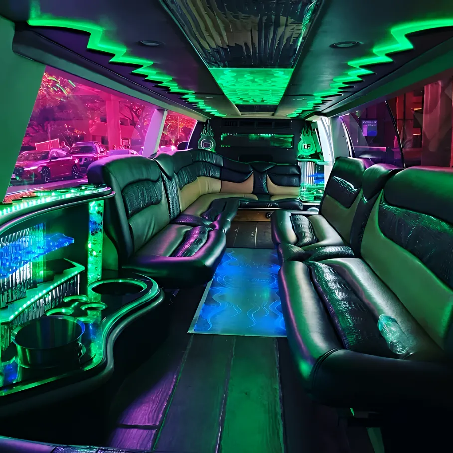 Interior of white Cadillac Escalade stretch limousine with elegant cabin seating