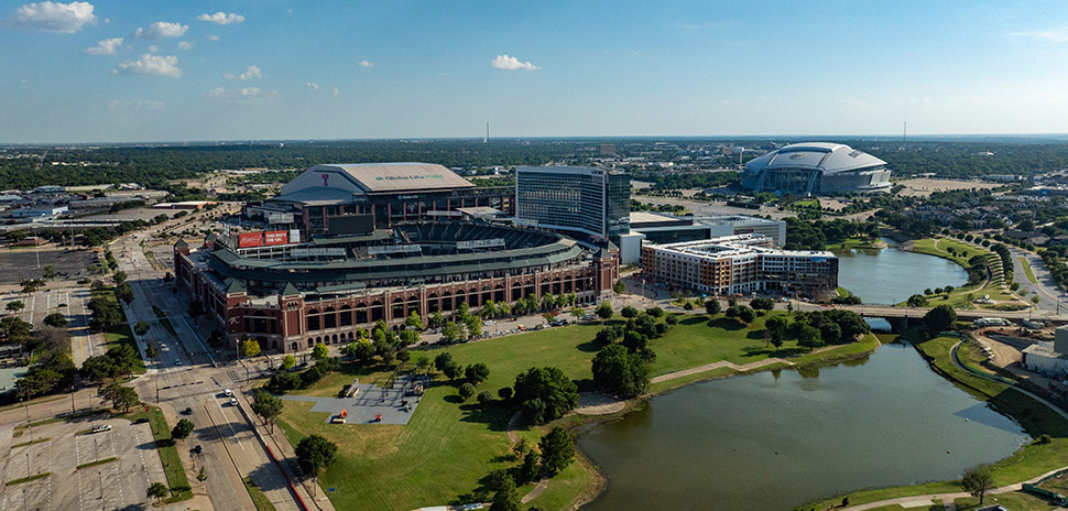 Aerial view of AT&T Stadium and Globe Life Field in Arlington TX showing the scale of the Arlington Entertainment District