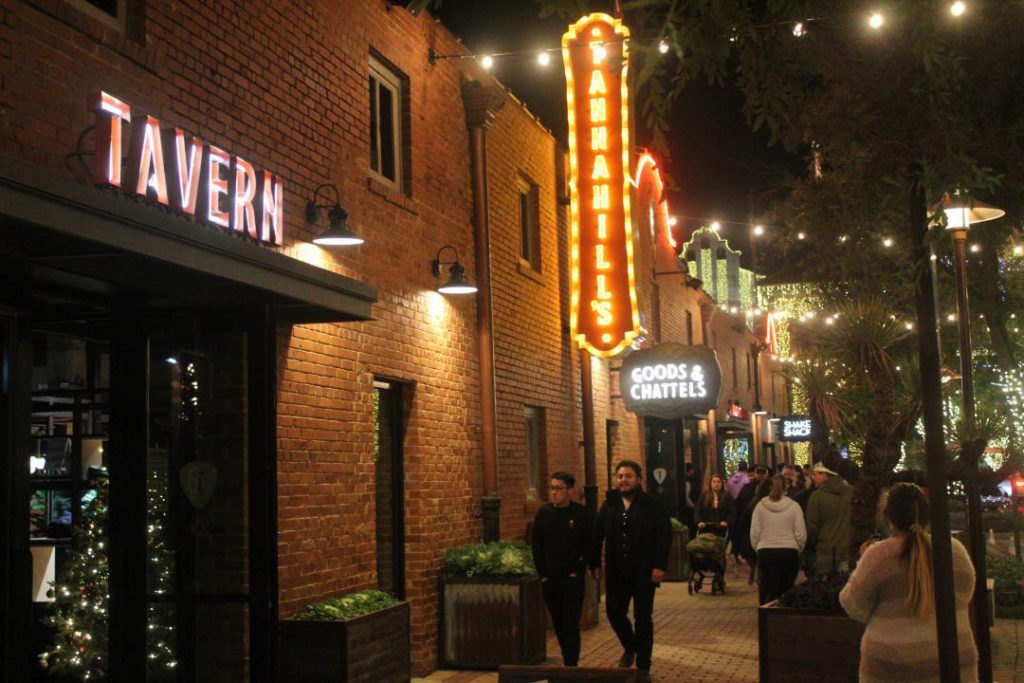The Tannahill's Tavern & Music Hall marquee over Mule Alley in the Fort Worth Stockyards at night — QTS Black Car & Limo transportation for September 2026 events