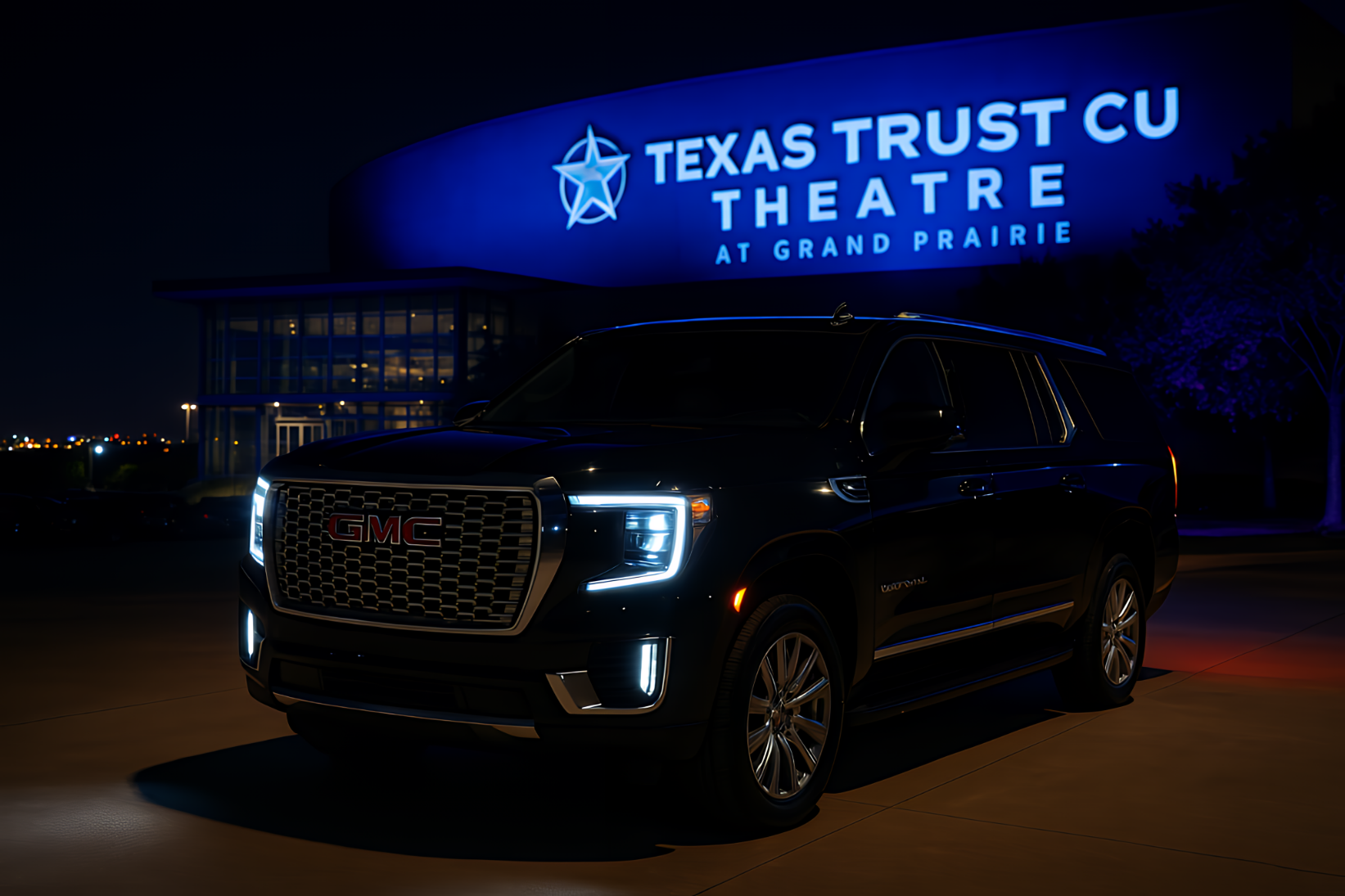 Nighttime drop-off at Texas Trust CU Theatre in Grand Prairie with a black executive SUV